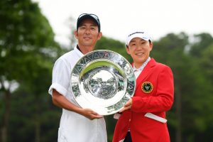 SODEGAURA, JAPAN - JUNE 30: Jiyai Shin of South Korea poses with her caddie after the award ceremony following the final round of the Earth Mondamin Cup at the Camellia Hills Country Club on June 30, 2019 in Sodegaura, Chiba, Japan. (Photo by Atsushi Tomura/Getty Images)